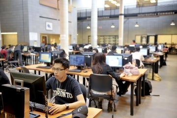 Photo of students at work in library