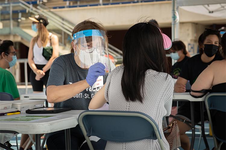 Professor Lynn Wilson administers a vaccination