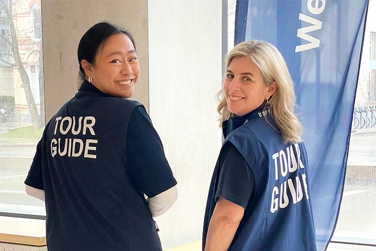 Faculty of Arts & Science Dean Melanie Woodin prepares to cover Chelsea Wang’s shift as a U of T tour guide