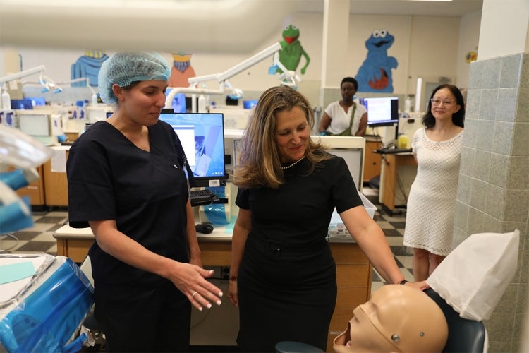 Freeland looks at a teaching mannequin in the childrens' lab