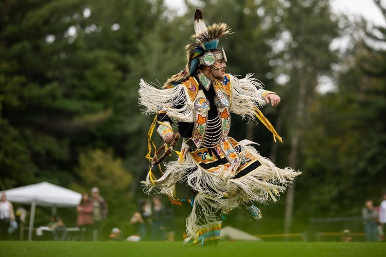 John Hupfield dances during the powwow